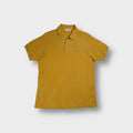 Lacoste polo shirt in yellow featuring iconic embroidered crocodile chest patch