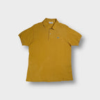 Lacoste polo shirt in yellow featuring iconic embroidered crocodile chest patch