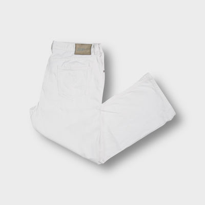 Joop jeans in white denim featuring a grey leather back patch on the waistband