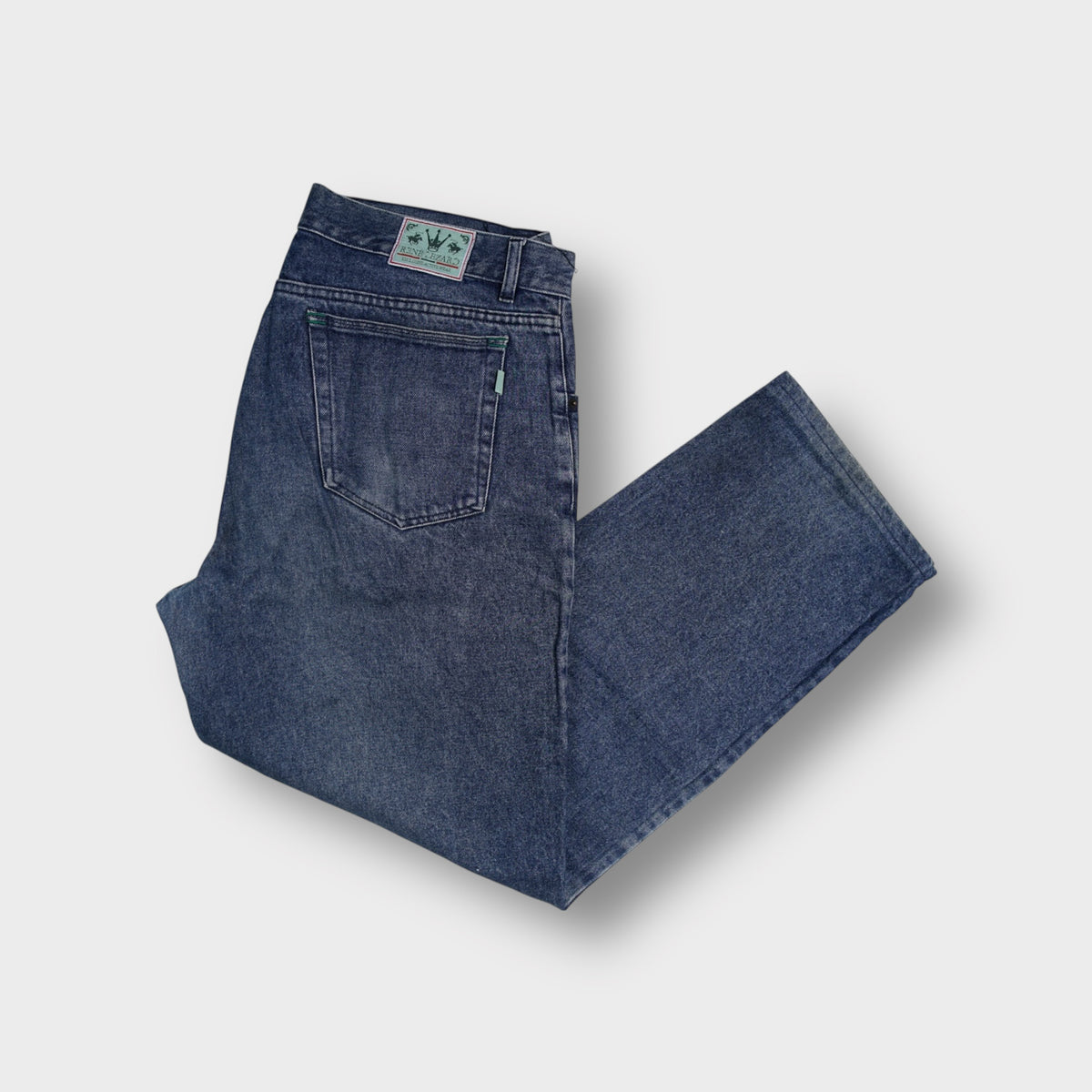 René Lezard denim jeans in blue featuring an embroidered logo patch on the back waistband