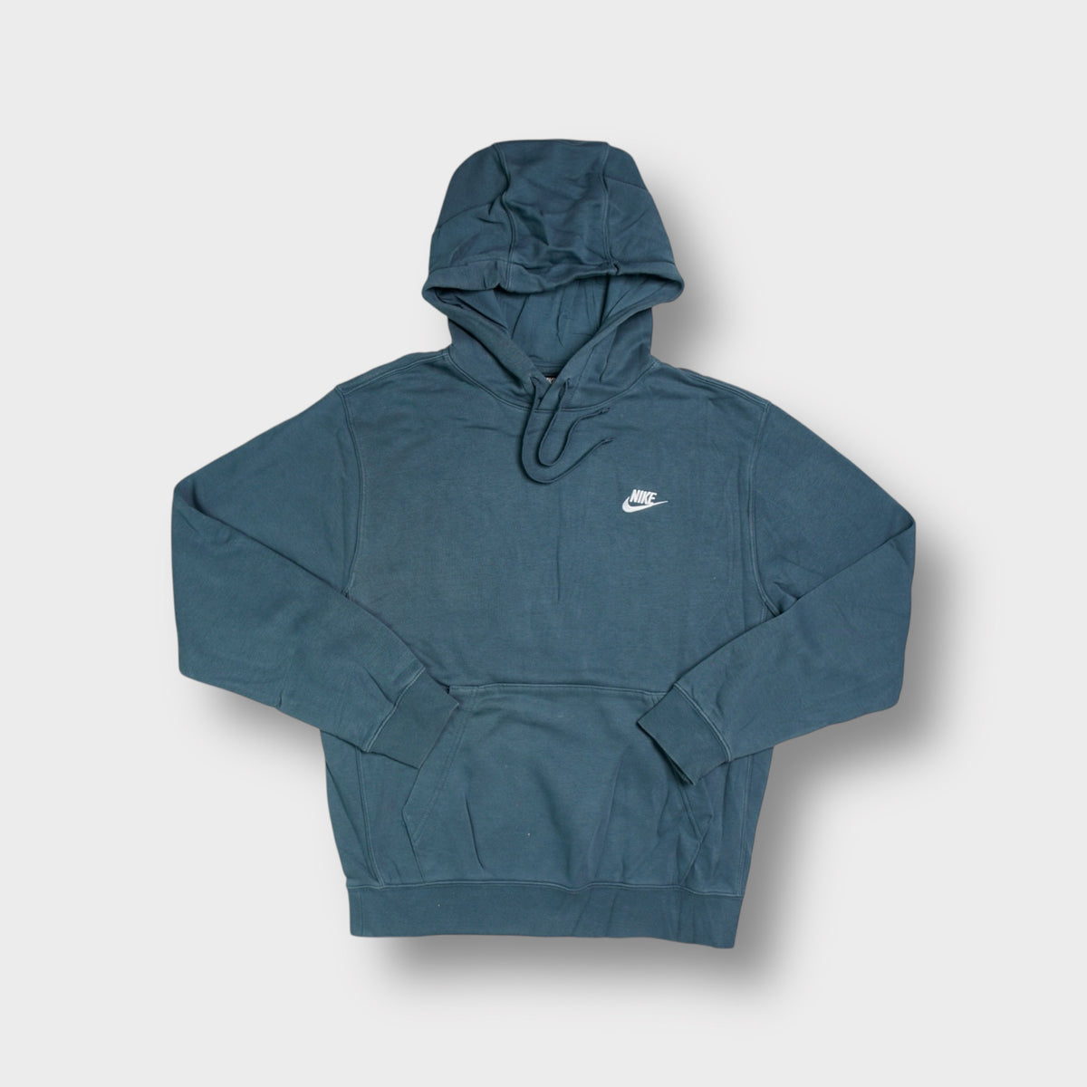 Blue Nike pullover hoodie featuring a white embroidered chest logo and drawstring hood.