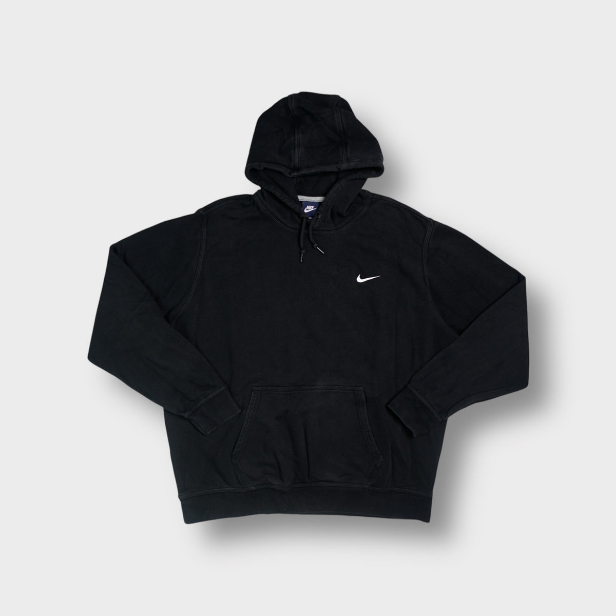 Nike navy blue hoodie sweater with a small white embroidered swoosh logo on chest
