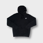 Black Nike hoodie featuring small white embroidered swoosh logo on the chest