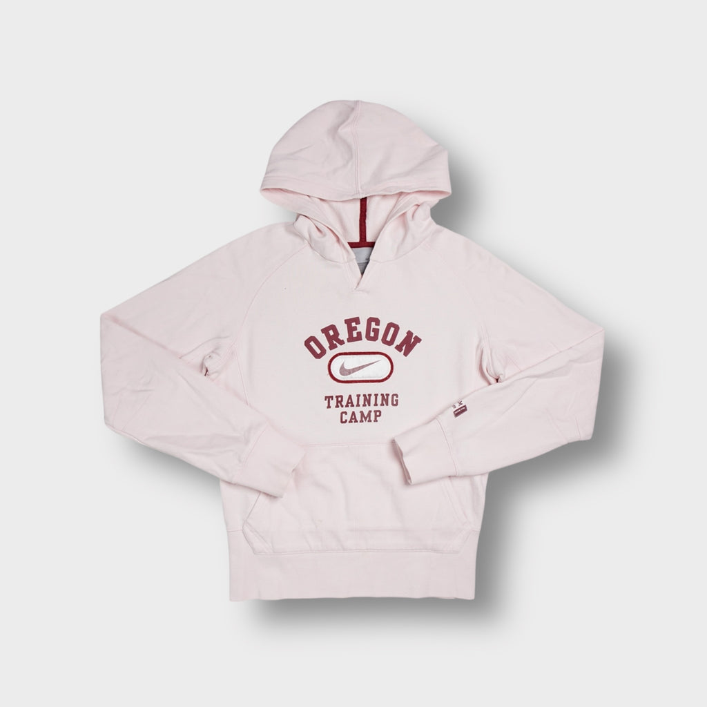 Rose Nike hoodie featuring a maroon Oregon Training Camp chest graphic print.