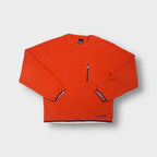 Nike fleece sweater in bright orange featuring a vertical zipped chest pocket