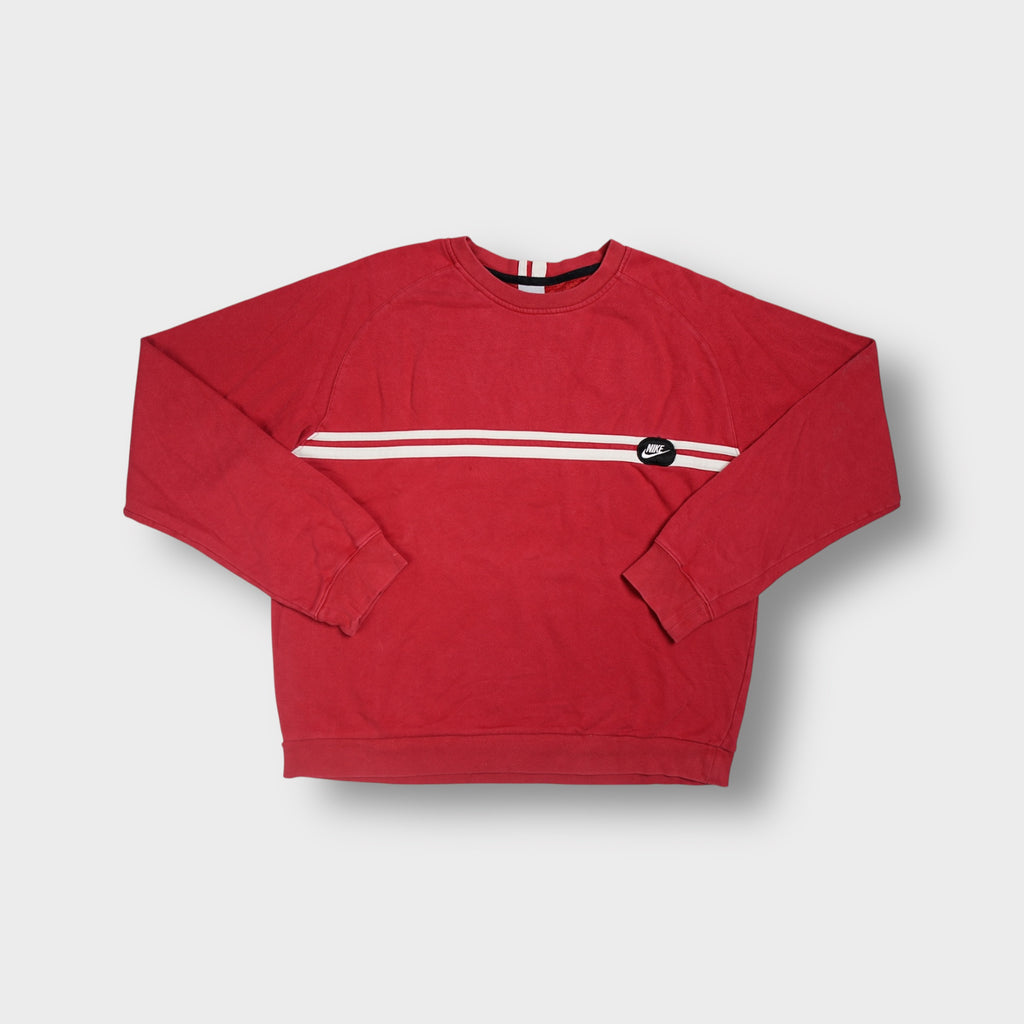 Red Nike crewneck sweater with a white chest stripe and circular logo patch