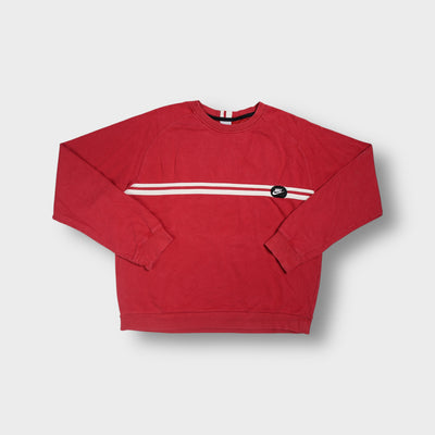 Red Nike crewneck sweater with a white chest stripe and circular logo patch