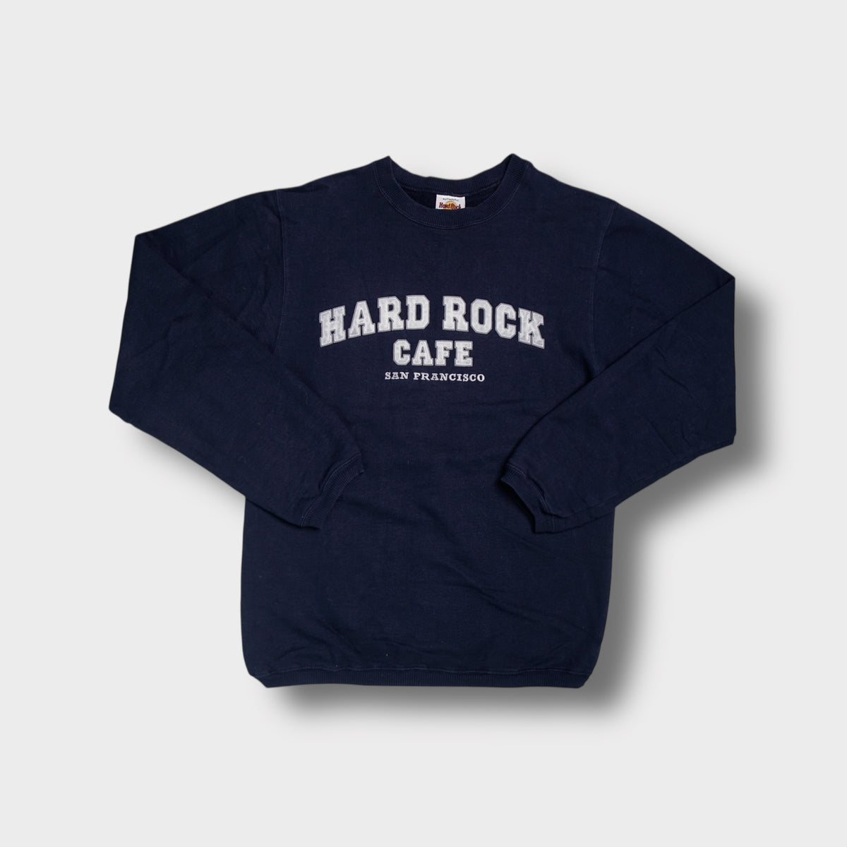 Hard Rock Cafe sweater in navy blue with San Francisco lettering embroidered on the chest.