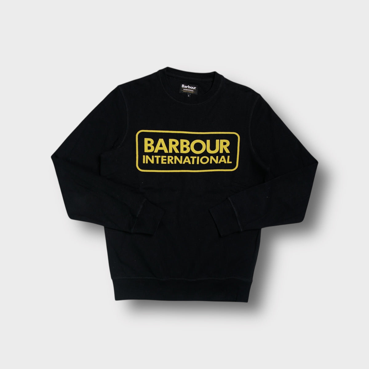 Barbour International black sweatshirt featuring a framed yellow chest logo