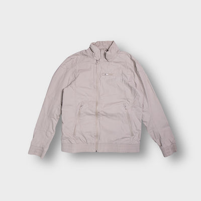 G-Star jacket in beige featuring zipped front pockets and a high collar