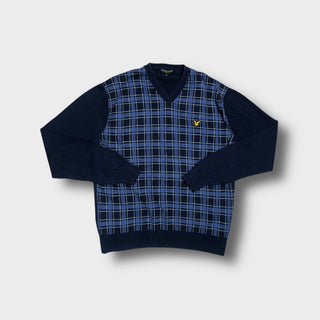 Lyle & Scott V-neck sweater in blue featuring a checked front panel and yellow eagle logo.