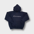 Champion hoodie in navy blue featuring an embroidered script logo across the chest.