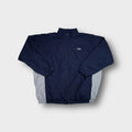 Umbro track jacket in navy blue with grey side panels and an embroidered chest logo