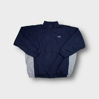 Umbro track jacket in navy blue with grey side panels and an embroidered chest logo