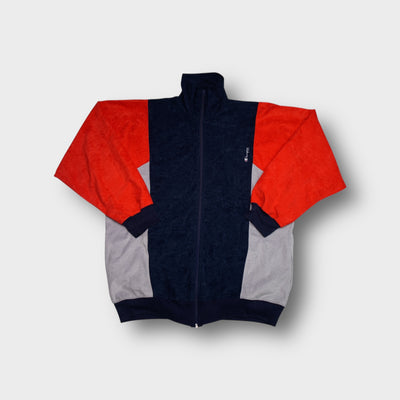 Champion track jacket in navy blue with red panelled sleeves and embroidered logo.