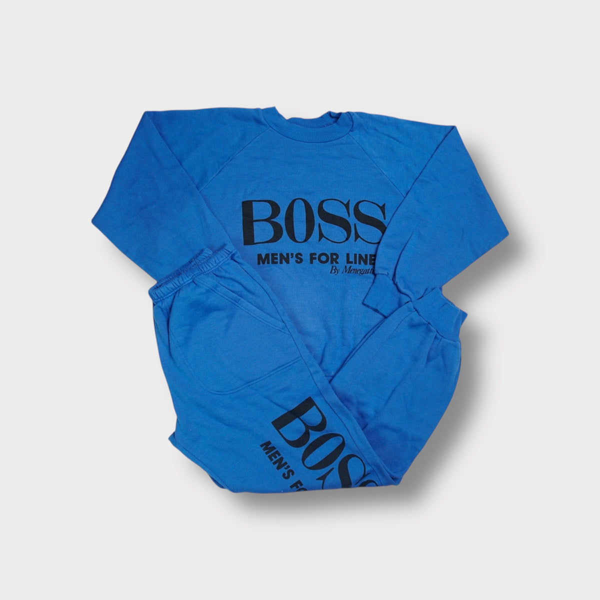 Hugo Boss blue sweatsuit with black printed text graphic on chest and leg
