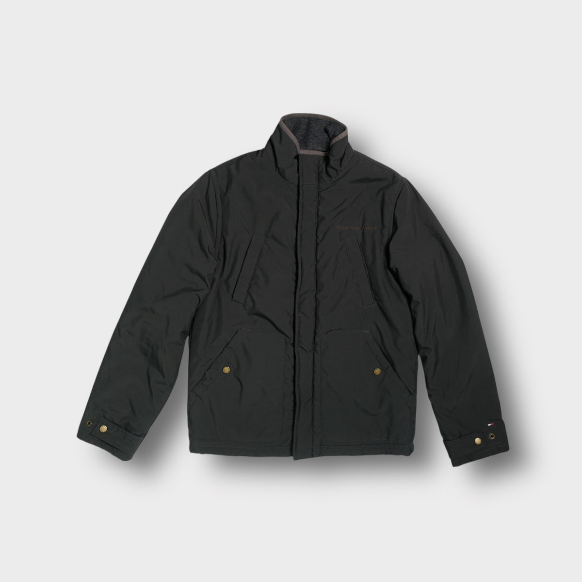 Tommy Hilfiger dark grey jacket featuring a fleece-lined collar and embroidered chest logo