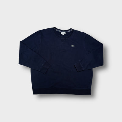 Lacoste Sport crewneck sweater in navy blue with an embroidered crocodile patch on the chest.