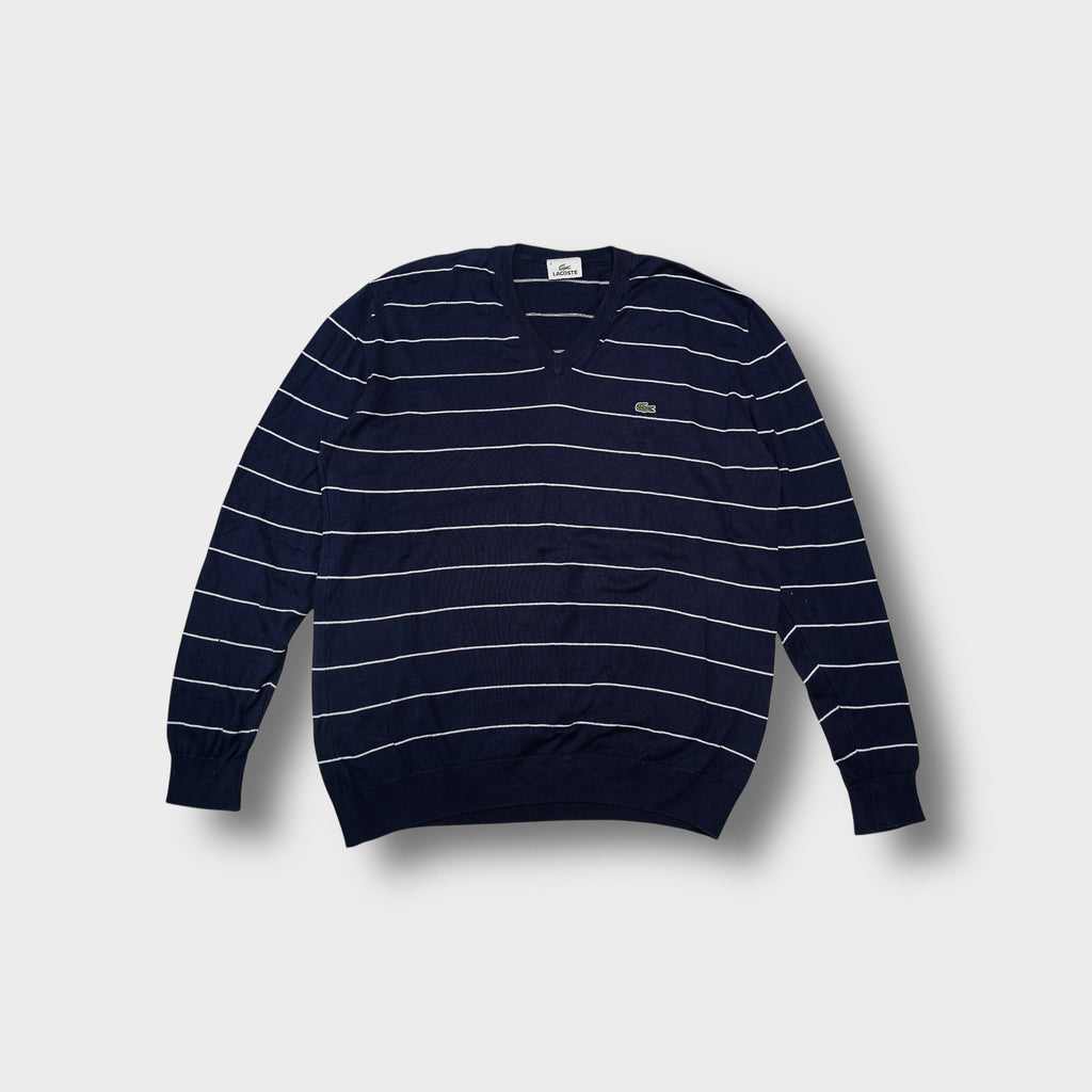 Lacoste knit sweater in navy blue featuring white horizontal stripes and a V-neck.