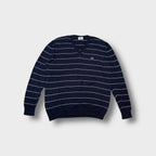 Lacoste knit sweater in navy blue featuring white horizontal stripes and a V-neck.
