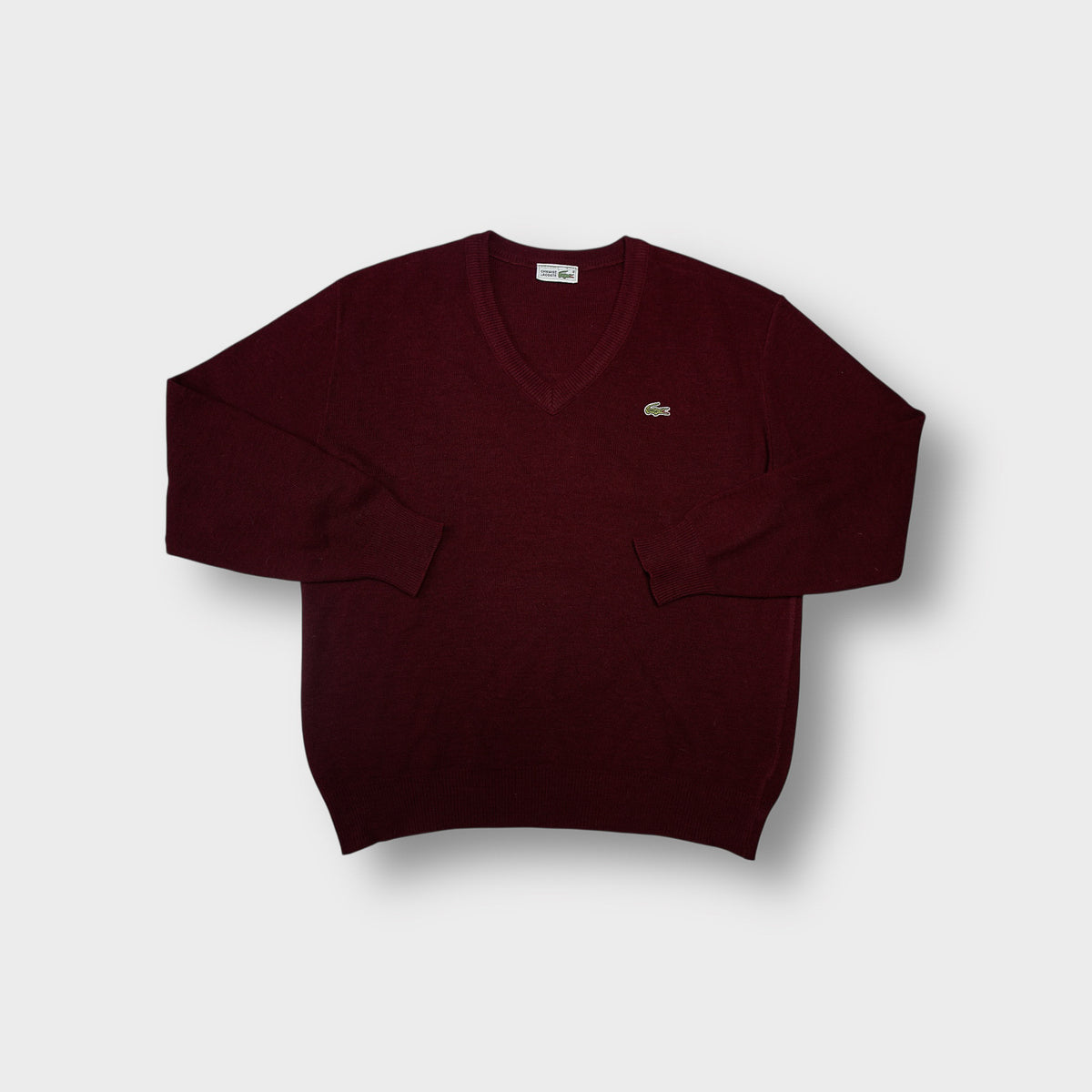 Lacoste knit sweater in dark red featuring an embroidered crocodile logo on chest