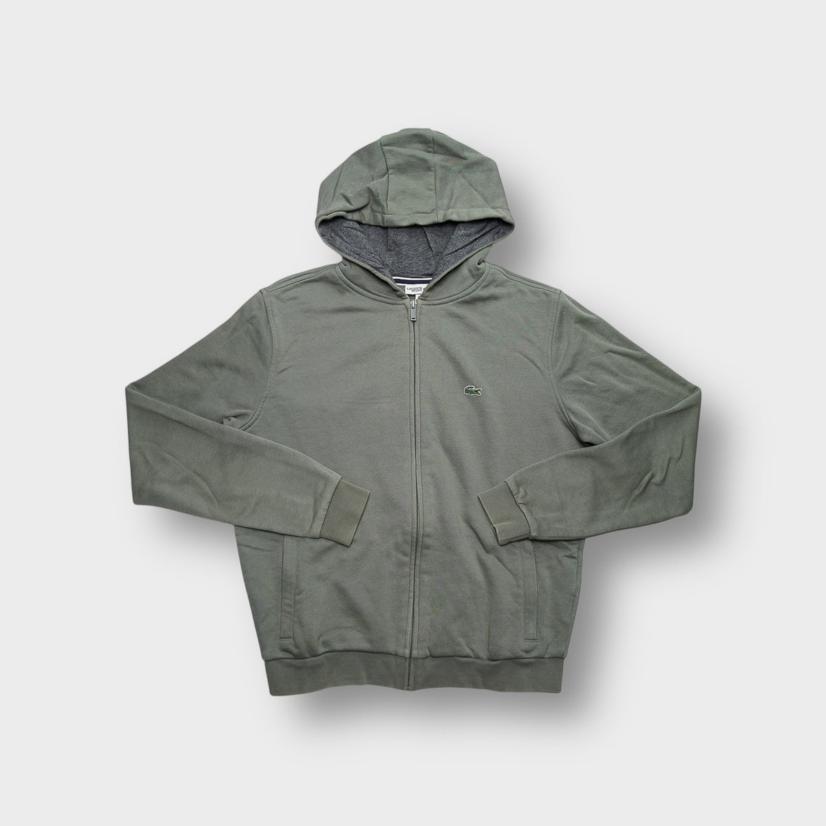 Lacoste full-zip sweatjacket in khaki green with an embroidered crocodile logo on chest