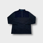 Blue Barbour sweater with a half-zip neckline and embroidered chest logo