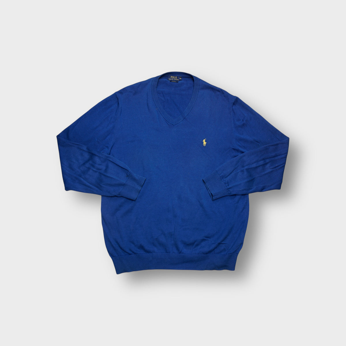 Ralph Lauren sweater in blue with yellow embroidered pony logo on chest and V-neck