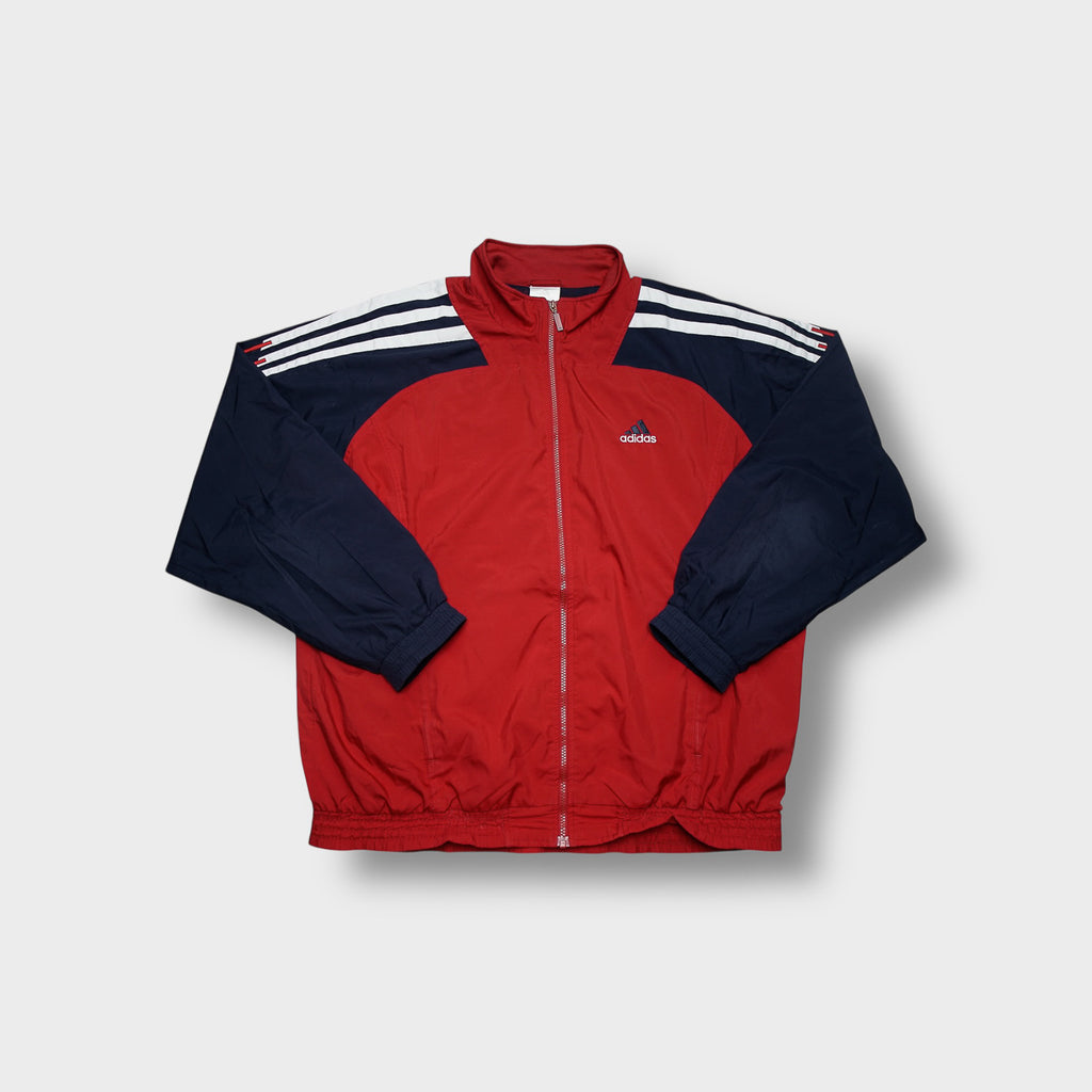 Adidas track jacket in red and navy featuring white three-stripes on shoulders