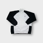 Adidas track jacket in white and black with embroidered chest logo and high collar