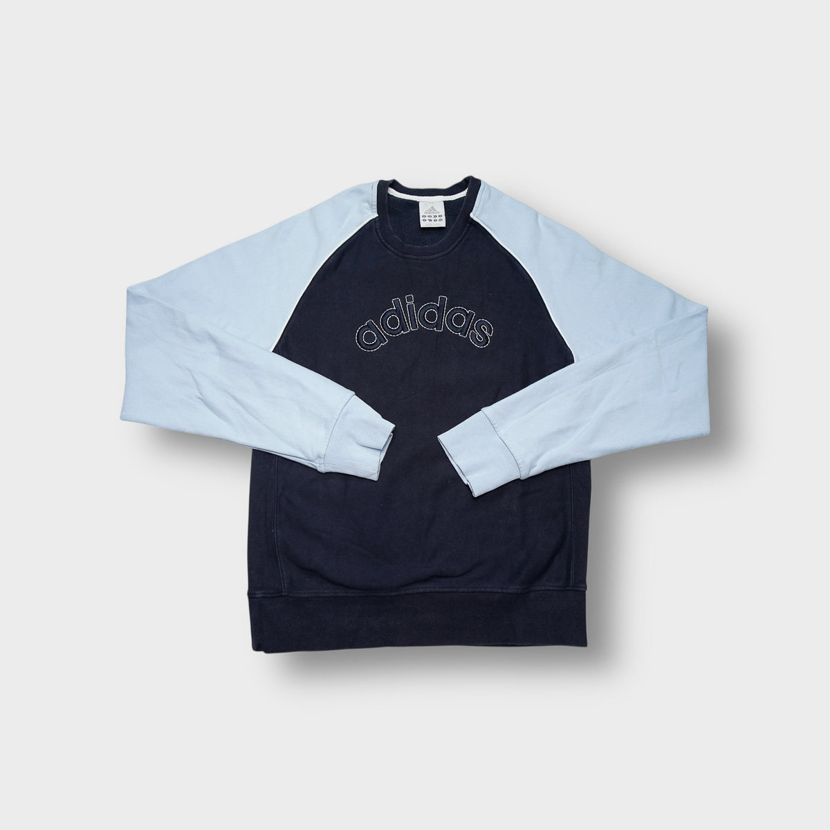 Adidas sweater in navy blue and light blue with stitched chest logo