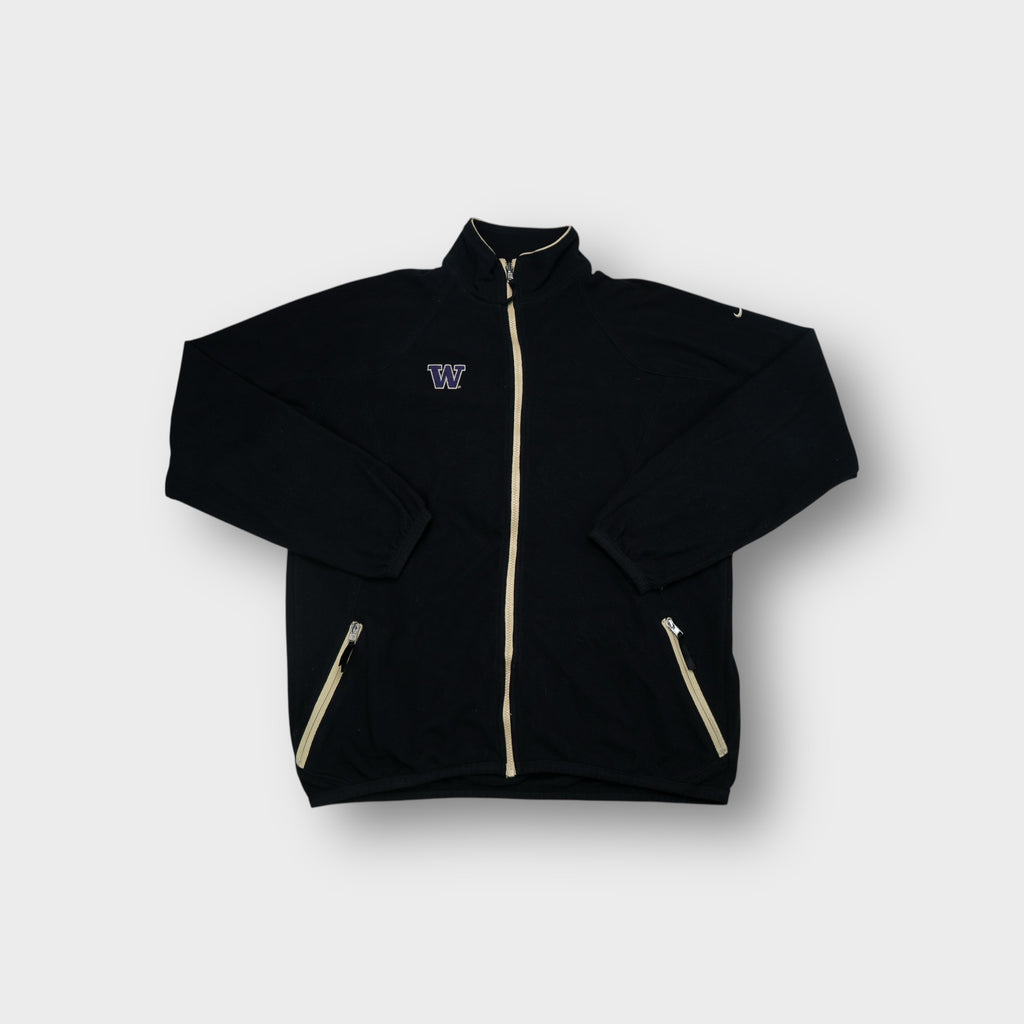 Black Nike fleece jacket with embroidered purple W chest logo and tan zip trim.