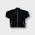 Black Nike fleece jacket with embroidered purple W chest logo and tan zip trim.