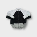 Nike track jacket in black and white with small silver embroidered swoosh logo
