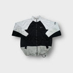 Nike track jacket in black and white with small silver embroidered swoosh logo