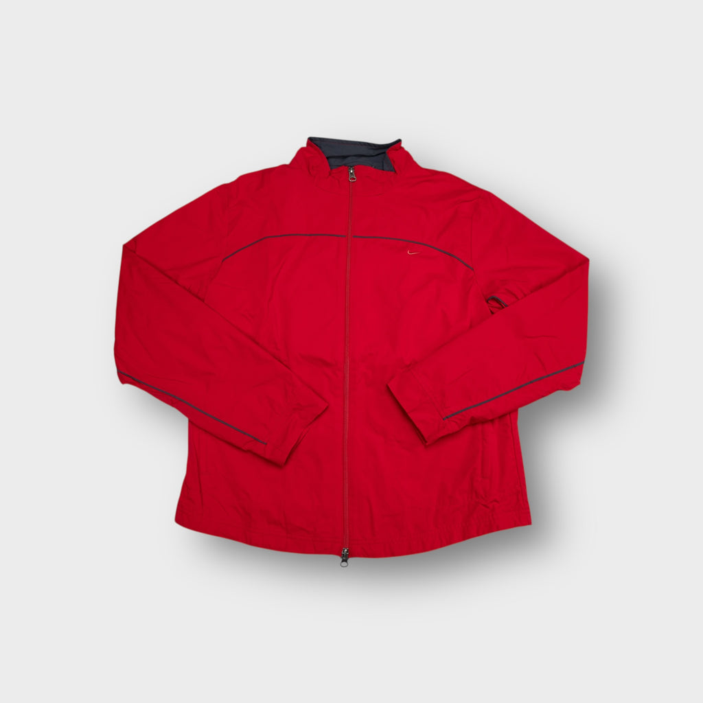 Red Nike track jacket with small embroidered swoosh and contrasting trim detail