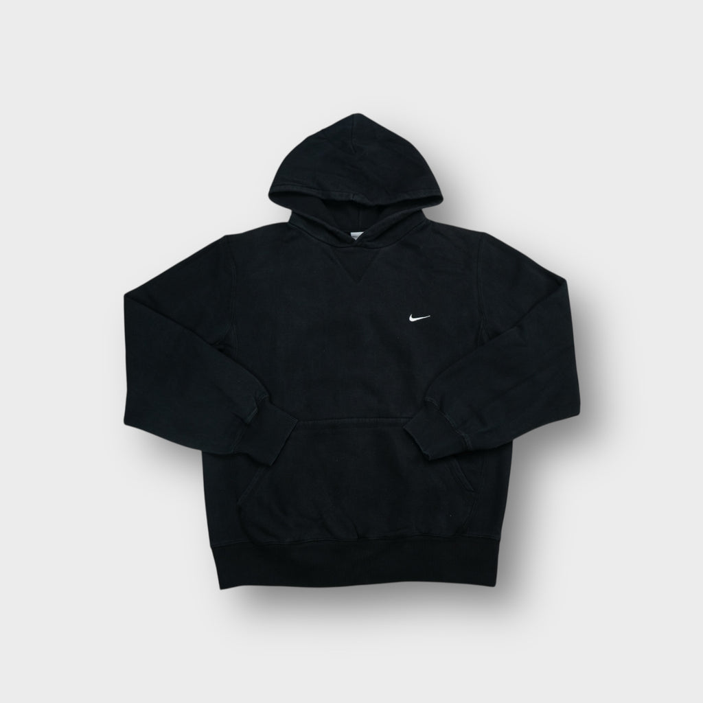 Nike pullover hoodie in black featuring small white embroidered swoosh on left chest