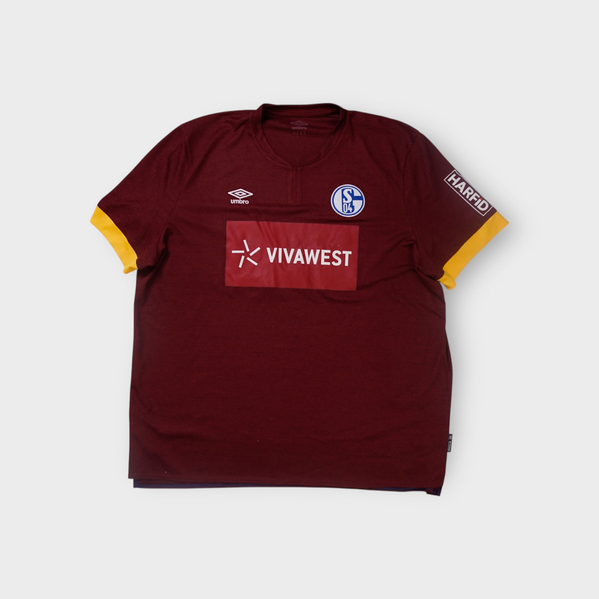 Umbro FC Schalke 04 football jersey in deep red with yellow sleeve trim and embroidered crest