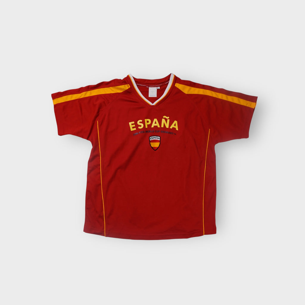 Red Spain 2006 World Cup football jersey with yellow España print and V-neck collar
