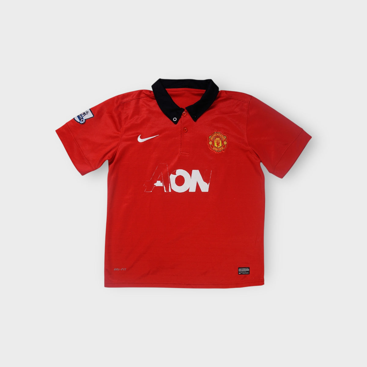 Nike Manchester United red football jersey with black polo collar and Rooney 10 print