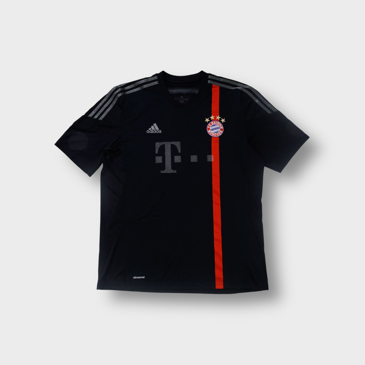 Black Adidas FC Bayern jersey featuring a red stripe and embroidered crest on front.