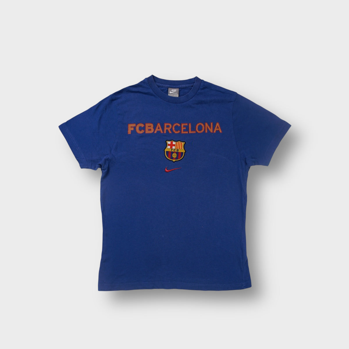 Nike blue FC Barcelona T-Shirt with printed chest lettering and embroidered crest patch