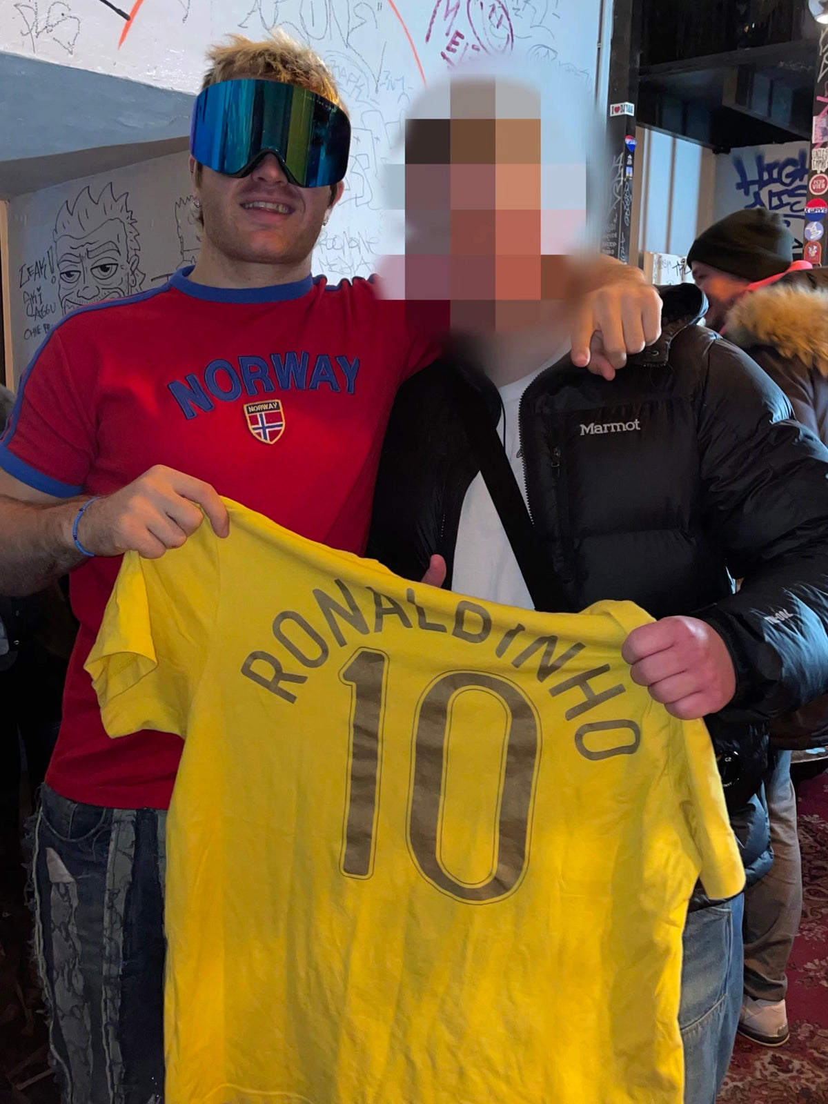 Yellow Ronaldinho Brazil jersey from the ninetyvintage shop, held up.
