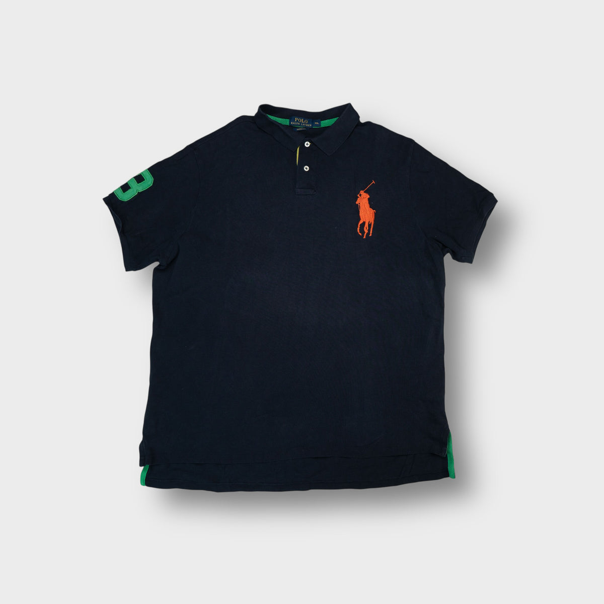 Ralph Lauren polo shirt in navy blue with oversized orange Big Pony embroidery.