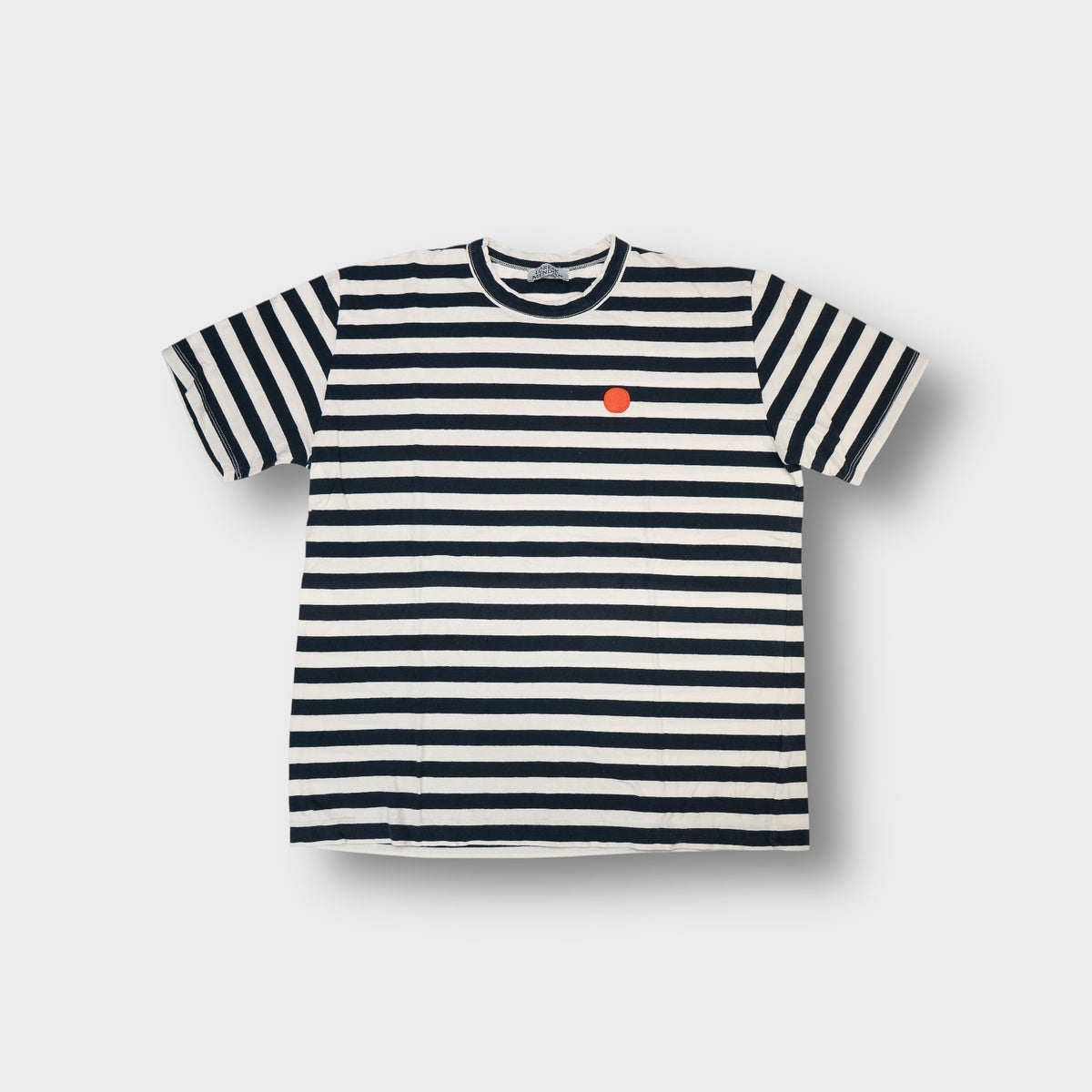 Loreak Mendian striped T-Shirt in black and white with a red round patch on chest
