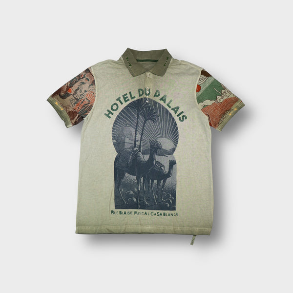 Desigual polo shirt in green featuring patterned sleeves and a central camel print