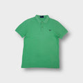 Fred Perry polo shirt in green with an embroidered dark laurel wreath chest logo