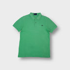 Fred Perry polo shirt in green with an embroidered dark laurel wreath chest logo