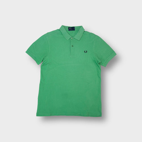 Fred Perry polo shirt in green with an embroidered dark laurel wreath chest logo