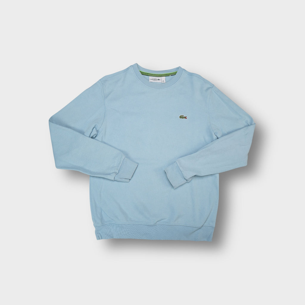 Lacoste sweater in light blue with embroidered crocodile logo on the chest